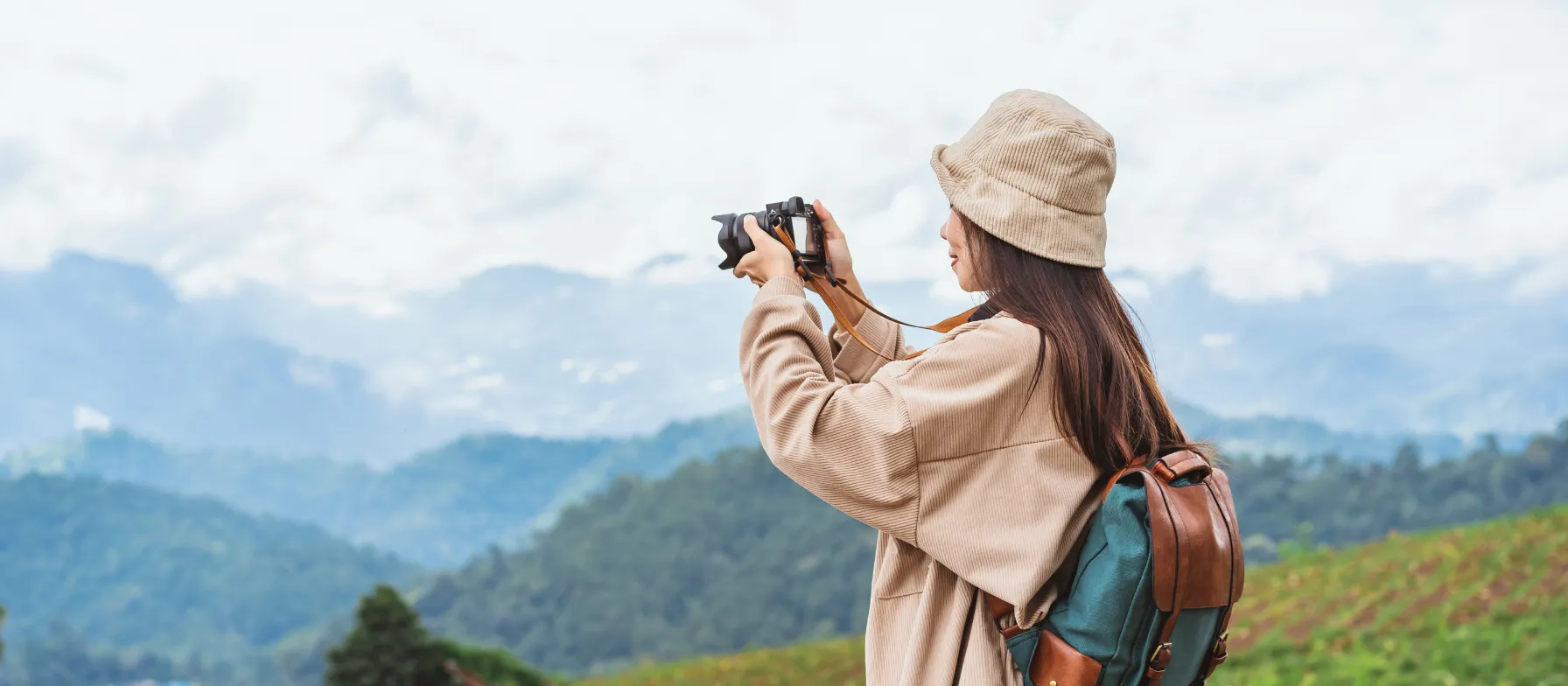 Travel CNA taking picture in the mountains