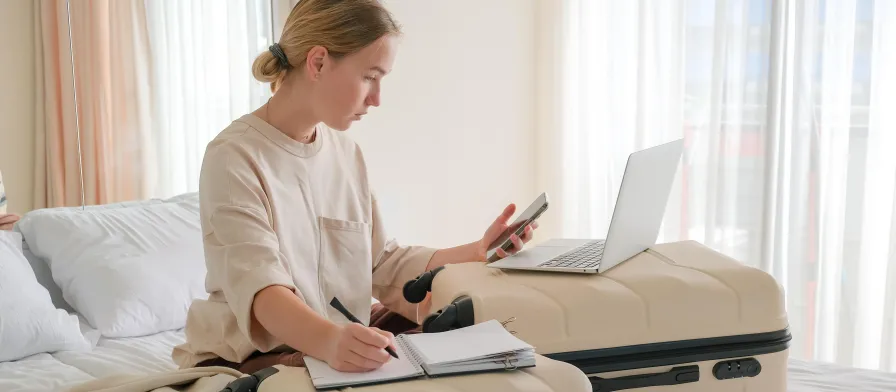 Travel nurse making a packing list of travel essentials.